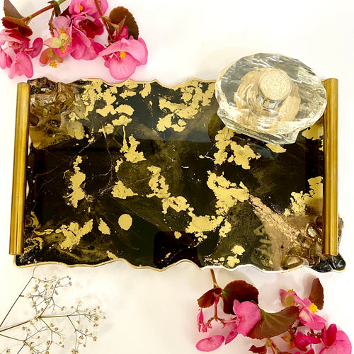 Black and gold tray with floating gold. Gold handles and gold edging.