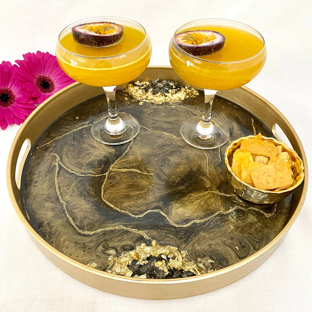 black and gold resin coated drinks tray with carry handles. Crushed glass to the sides and finished with gold gliter lines and gold leaf.